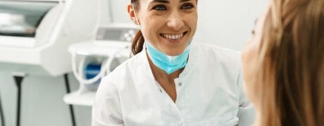 Dentist Smiling at Patient