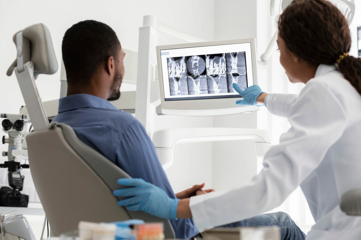 Dentist Showing Patient X-Rays