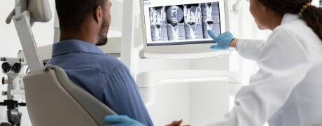 Dentist Showing Patient X-Rays