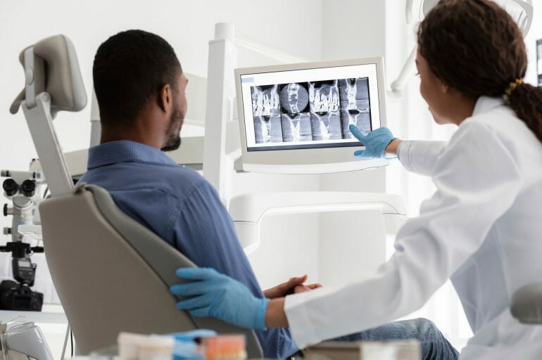 Dentist Showing Patient X-Rays